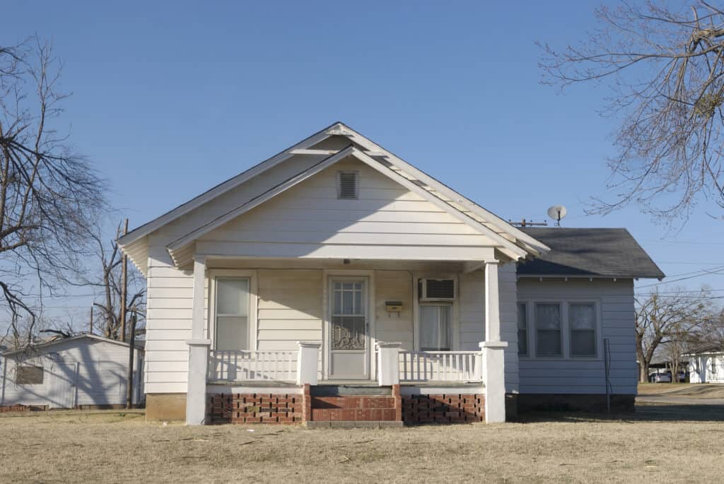 Small white cottage style house