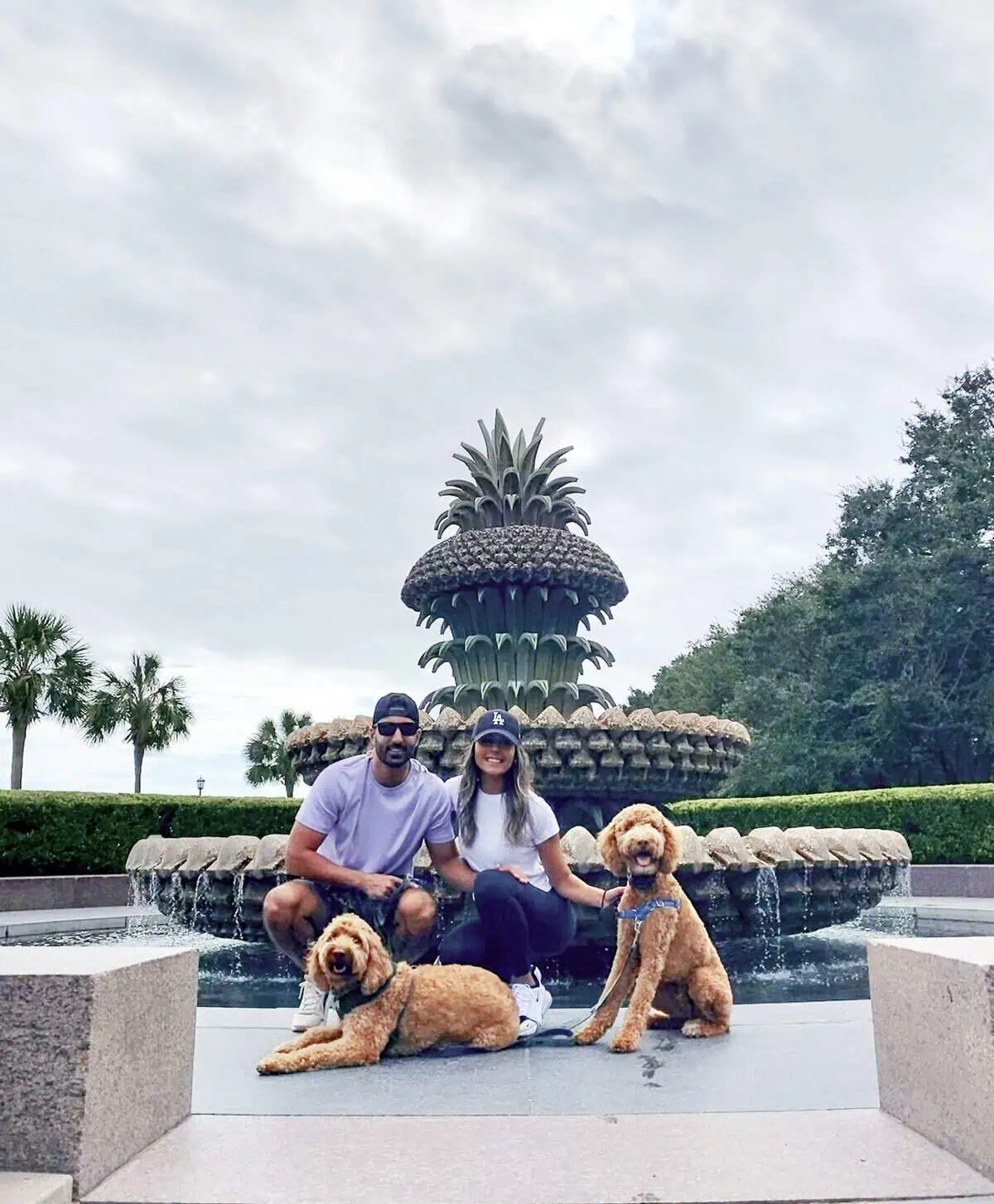 Nima and Lexi Toghiyani, owners of Full Circle Homes, with their dogs