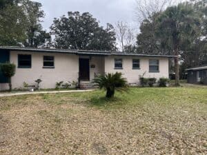Single-story Arlington Jacksonville home with front yard and palm tree.